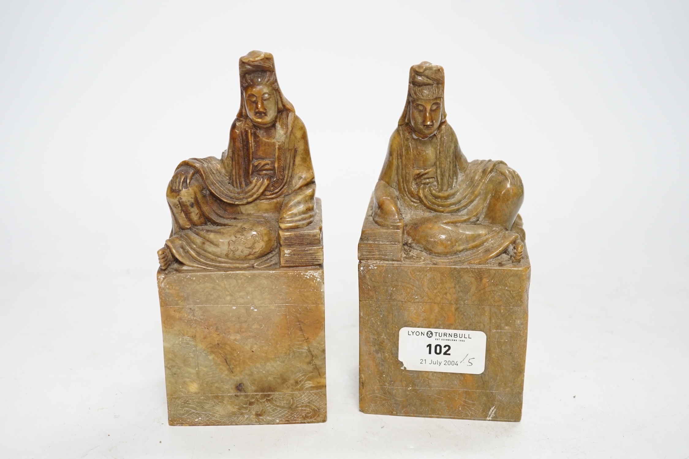 A pair of large Chinese soapstone ‘Guanyin’ seals, 16.5cm high